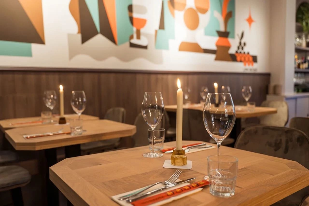 Table setup with candle and wine glasses